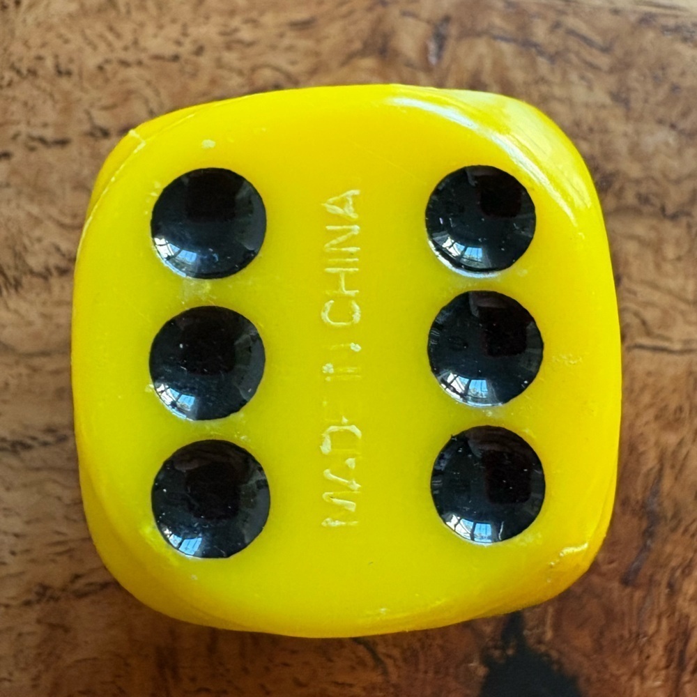 Vintage pair of yellow and black large dice